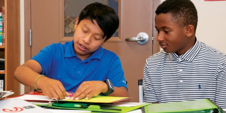 Two boys working on classwork