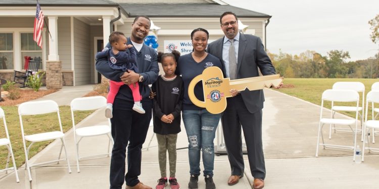 Shreves family with key at new home