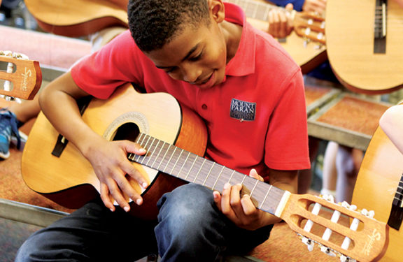 Mt. Paran student playing guitar