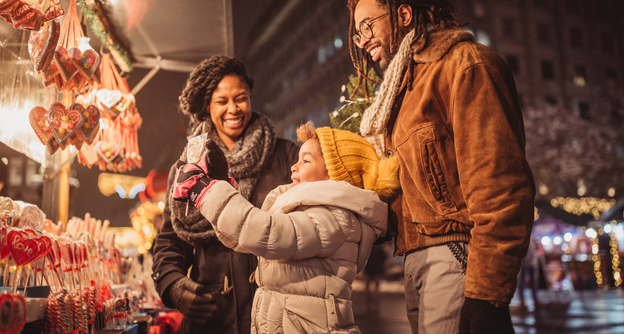a family shopping at a holiday market in Atlanta